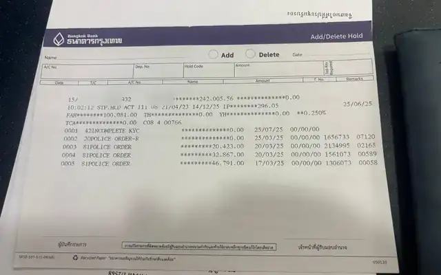 Bangkok Bank hold printout listing several police orders on one account, personal details hidden