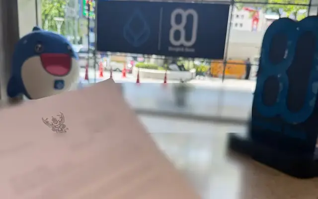 Police letter to Bangkok Bank held in a branch lobby, text hidden