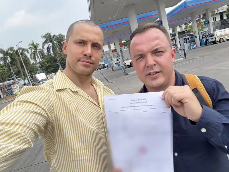 Arthur and the UnblockPro.Asia founder holding the police document that lifted the account hold, personal details hidden